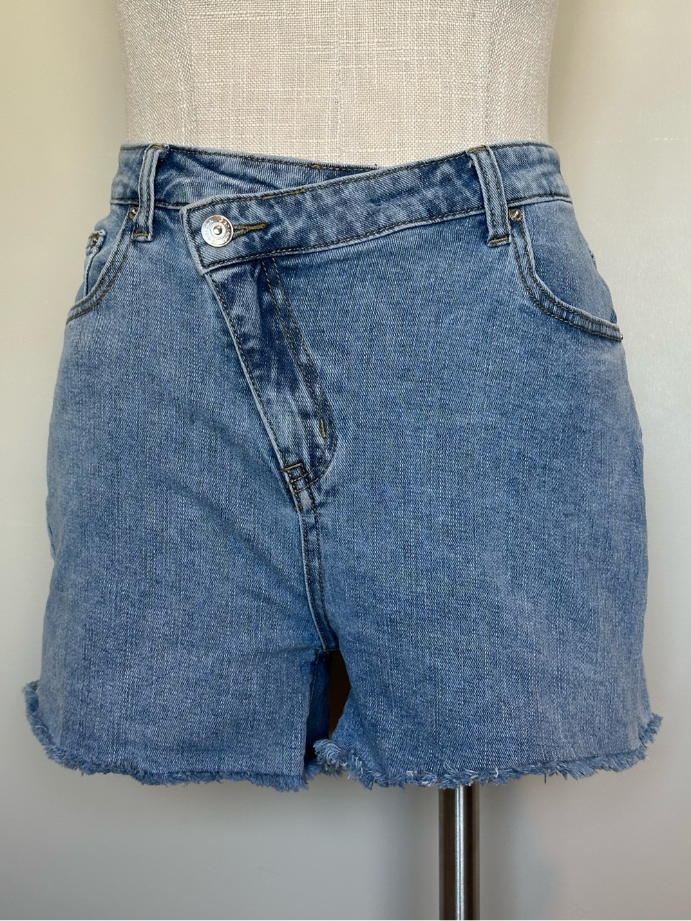 High-Rise Asymmetrical Crossover Denim Shorts - Medium Light Wash